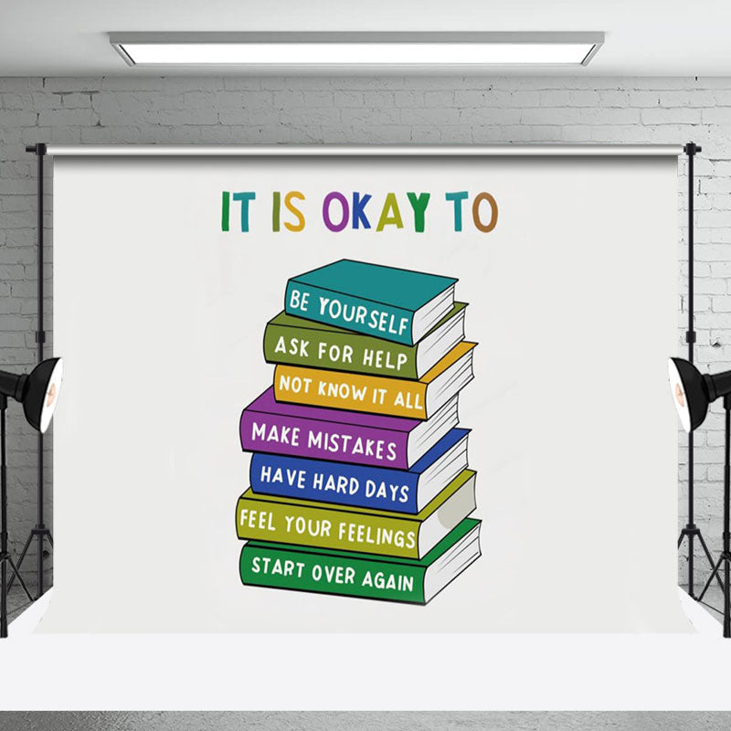 Aperturee - Stacked Books It Is Okay To Positive Slogan Backdrop