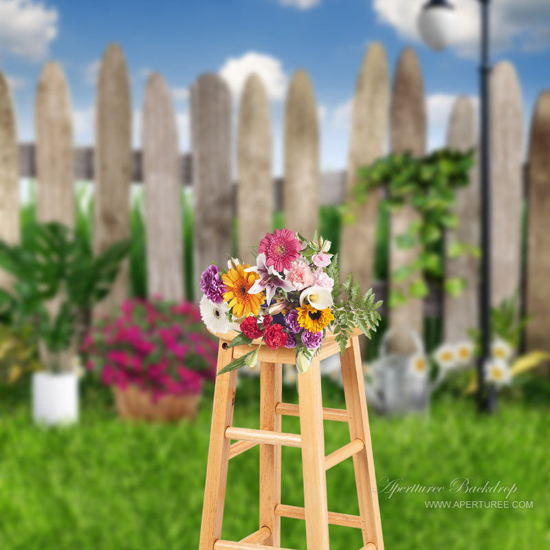 Aperturee - Wooden Fence Flowers Grass Blue Sky Spring Photo Backdrop